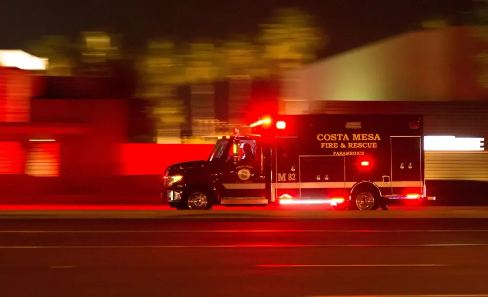 ambulance at night with lights flashing.